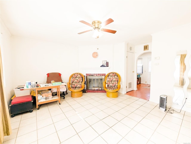 game room with ceiling fan and light tile patterned flooring