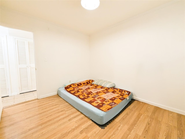 bedroom with hardwood / wood-style flooring