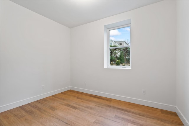 empty room with light hardwood / wood-style floors