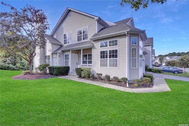 front facade with a porch and a front yard