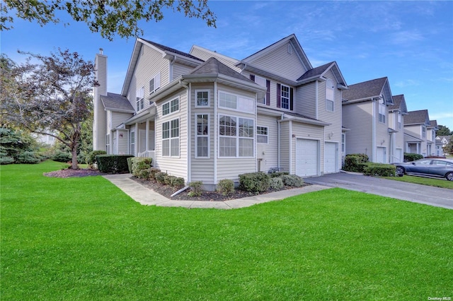 view of front facade with a front lawn and a garage