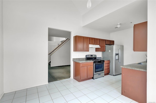 kitchen featuring light carpet, appliances with stainless steel finishes, and sink