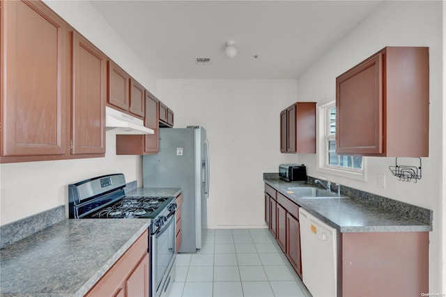 kitchen featuring dishwasher, stainless steel gas stove, light tile patterned flooring, and sink