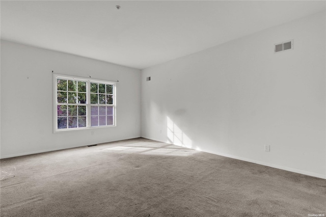 unfurnished room featuring carpet floors