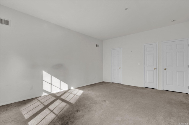 spare room with light carpet