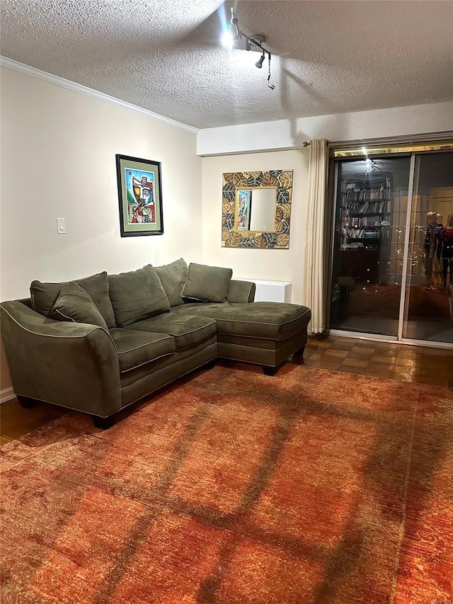 carpeted living room with a textured ceiling and ornamental molding