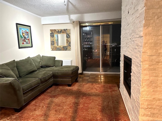 living room with a fireplace and a textured ceiling