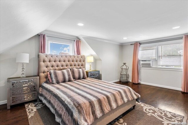 bedroom featuring cooling unit, crown molding, lofted ceiling, and dark wood-type flooring