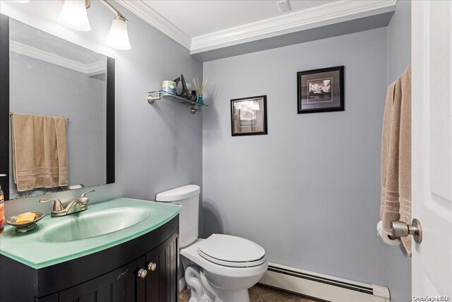 bathroom with vanity, tile patterned floors, crown molding, toilet, and a baseboard radiator