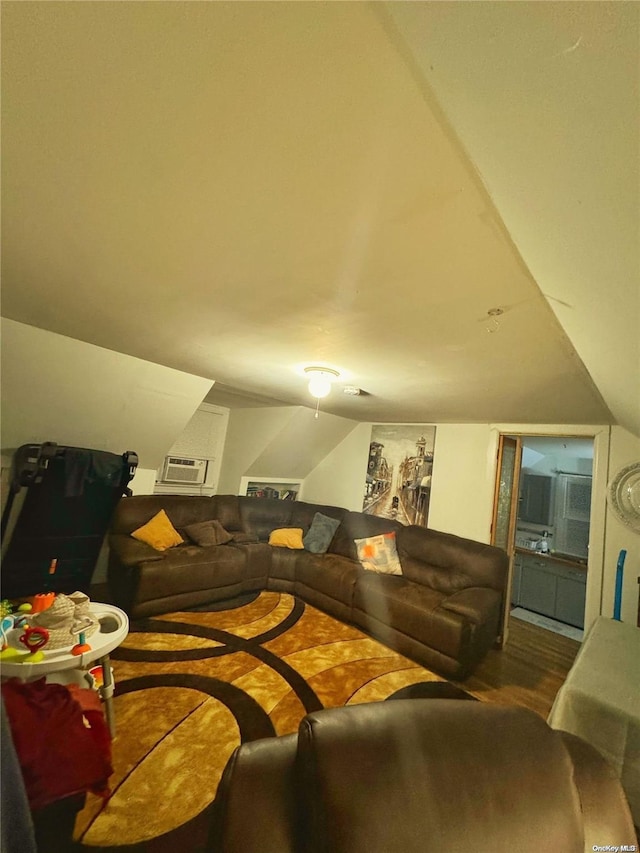 living room with hardwood / wood-style floors and lofted ceiling