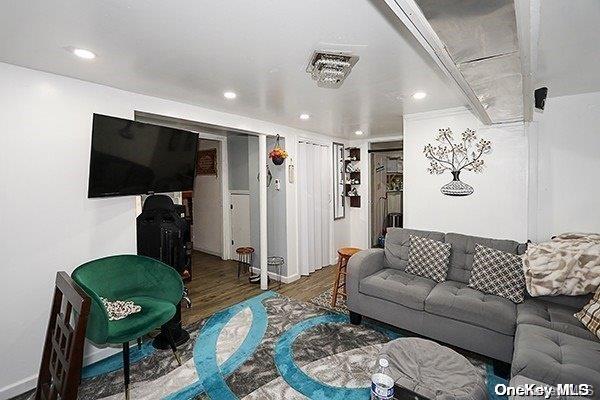 living room with dark hardwood / wood-style flooring