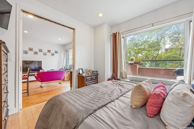 bedroom with light hardwood / wood-style flooring