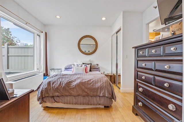 bedroom with light hardwood / wood-style flooring