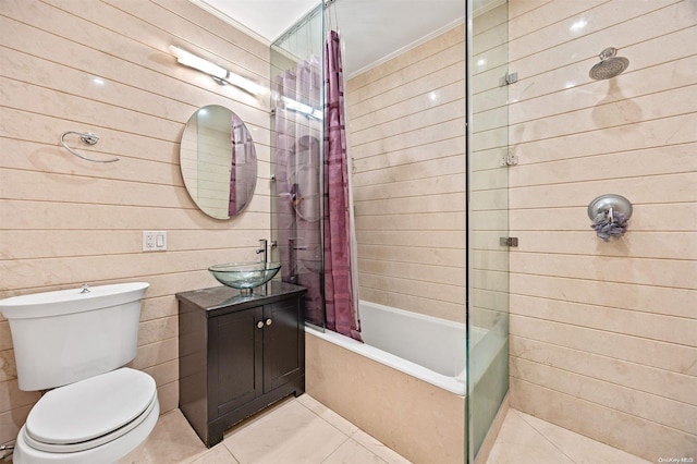 full bathroom featuring tile patterned flooring, vanity, toilet, and shower / tub combo