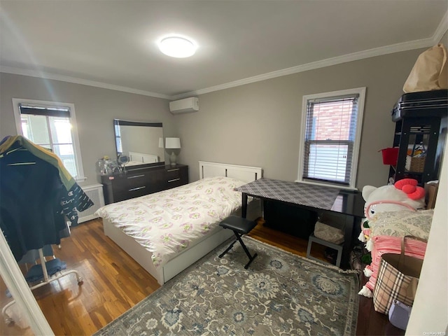 bedroom featuring dark hardwood / wood-style flooring, ornamental molding, and a wall mounted AC