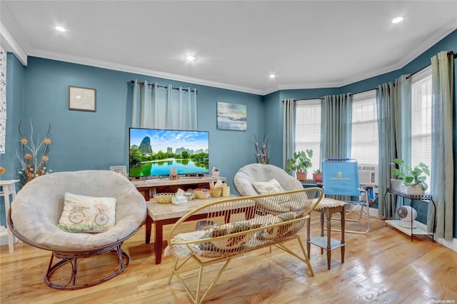 sitting room featuring crown molding and light wood-type flooring