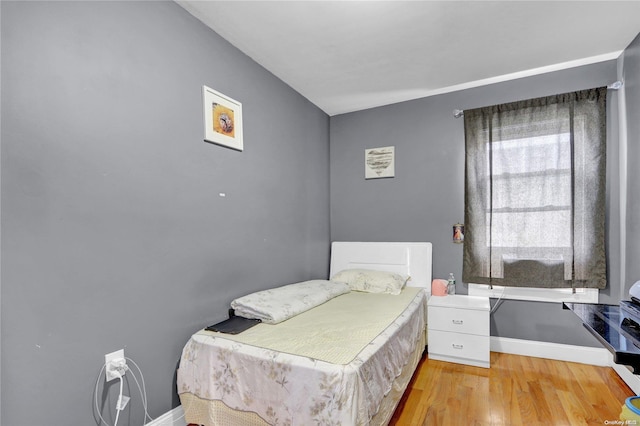 bedroom with light hardwood / wood-style flooring