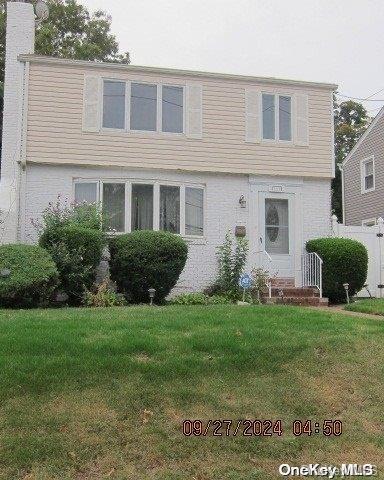 111 President St, Hempstead, NY 11550 - colonial home with a chimney