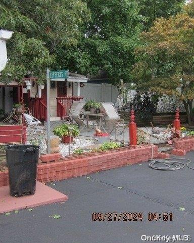 111 President St, Hempstead, NY 11550 - view of yard featuring a patio