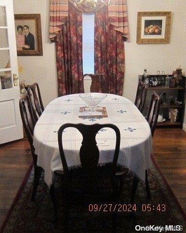 dining room featuring dark wood-type flooring