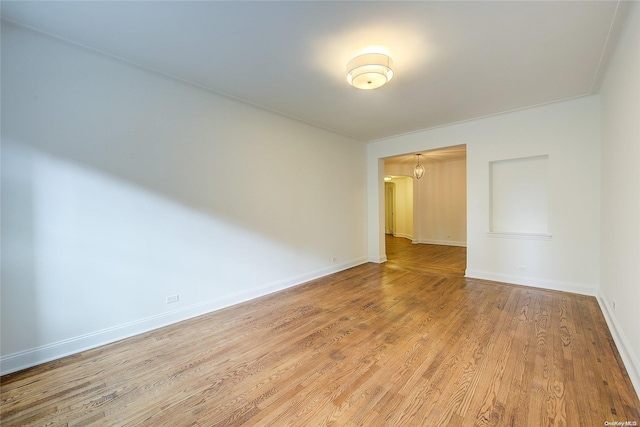 unfurnished room featuring light hardwood / wood-style floors