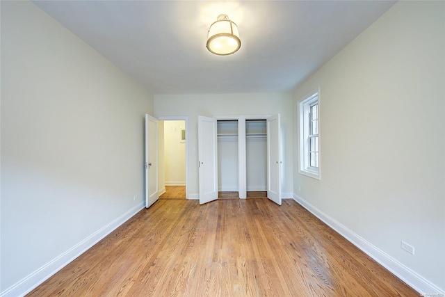 unfurnished bedroom with light wood-type flooring