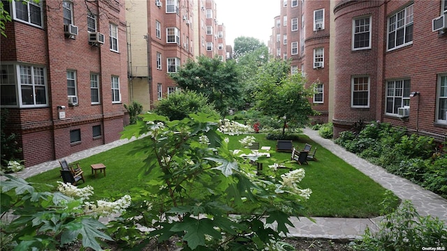 view of home's community featuring a lawn