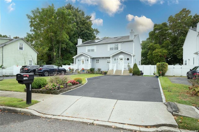 view of property featuring a front yard