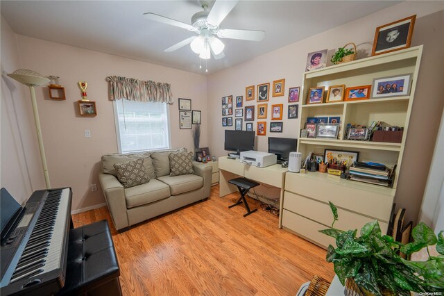 home office featuring light hardwood / wood-style floors and ceiling fan