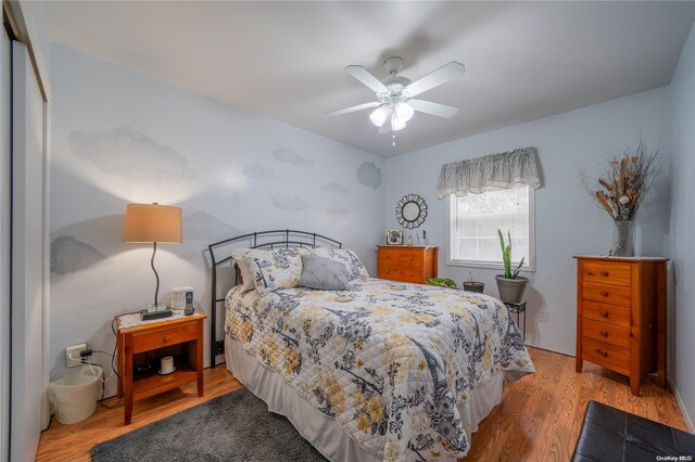 bedroom featuring ceiling fan and light hardwood / wood-style flooring