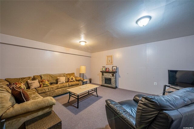 carpeted living room with a fireplace