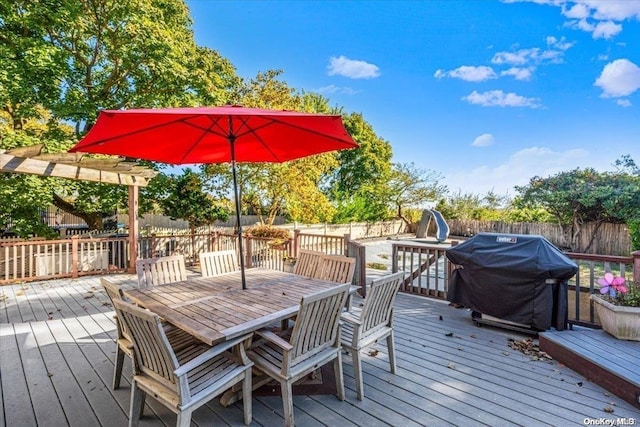 wooden terrace featuring a pergola and grilling area