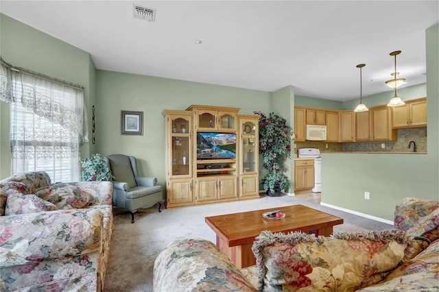 living room with light colored carpet