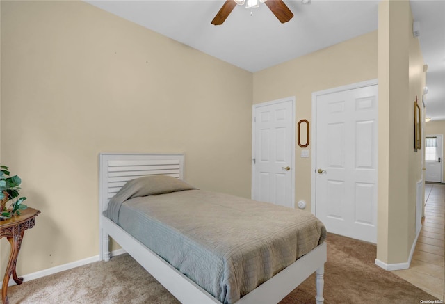 carpeted bedroom with ceiling fan