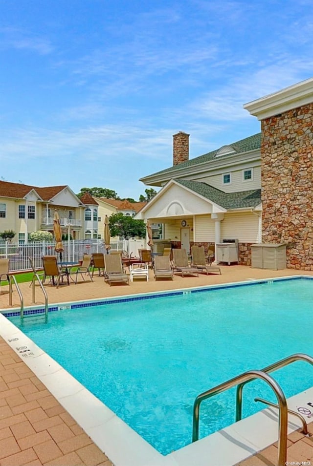 view of swimming pool featuring a patio