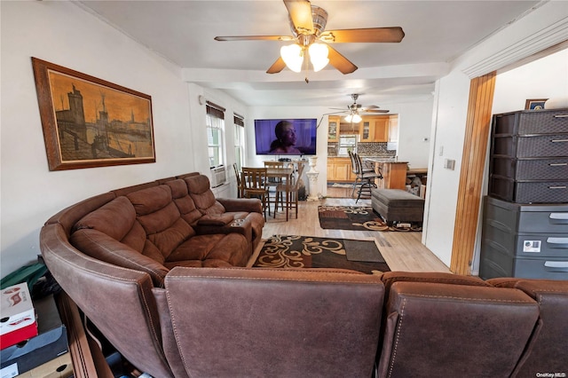 living room with ceiling fan and light hardwood / wood-style flooring