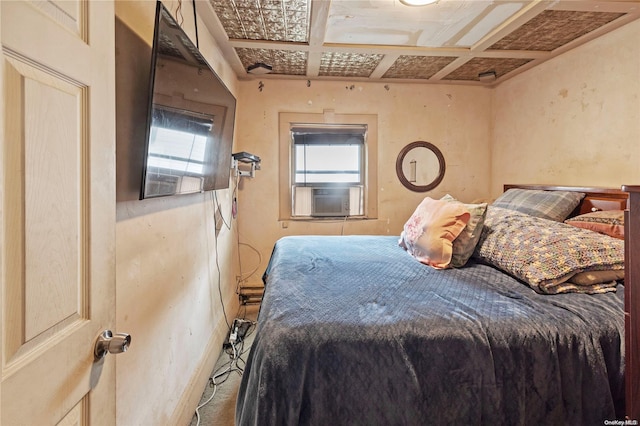 bedroom featuring cooling unit and coffered ceiling