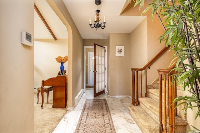 entrance foyer featuring vaulted ceiling with beams, french doors, a baseboard radiator, and an inviting chandelier