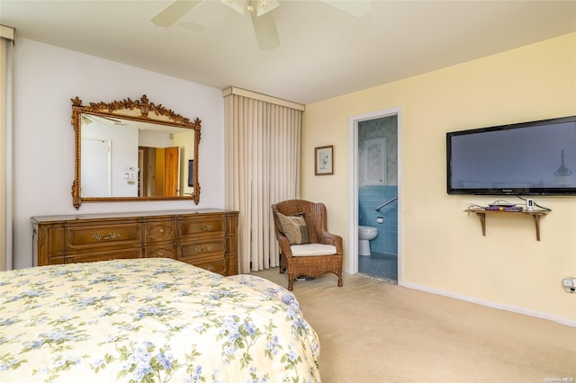 carpeted bedroom with connected bathroom and ceiling fan