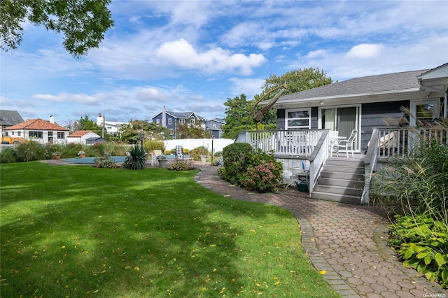 view of yard with a wooden deck