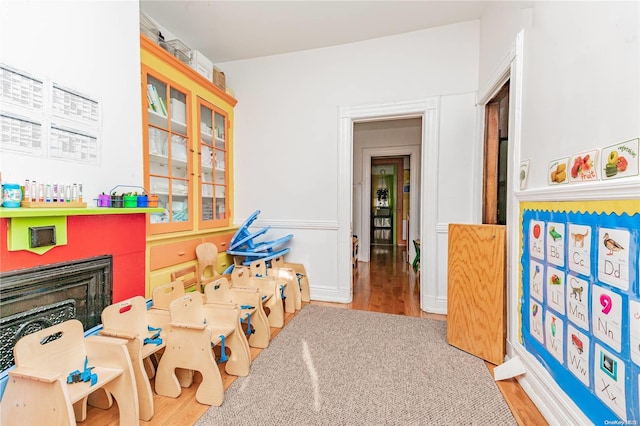 game room featuring light wood-type flooring