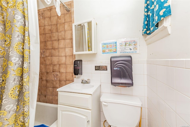 full bathroom with vanity, shower / bathtub combination with curtain, tile walls, and toilet