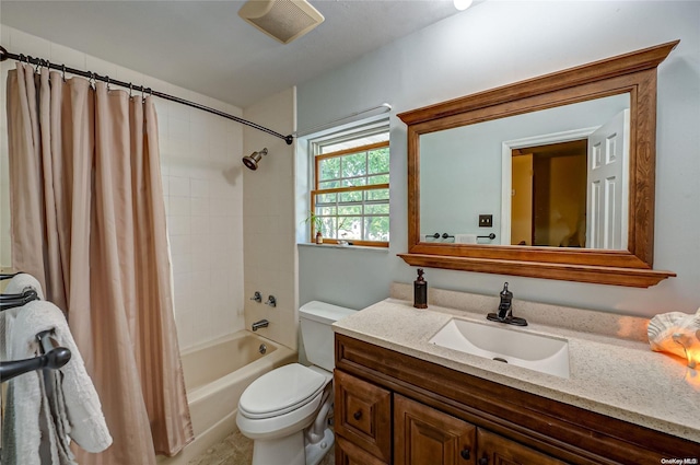 full bathroom featuring vanity, toilet, and shower / bathtub combination with curtain