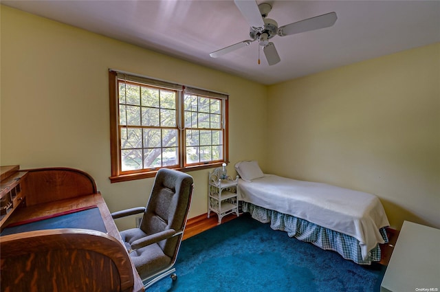 bedroom with wood-type flooring and ceiling fan