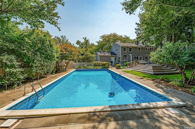 view of swimming pool featuring a deck