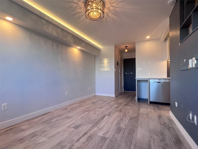 unfurnished living room featuring hardwood / wood-style flooring