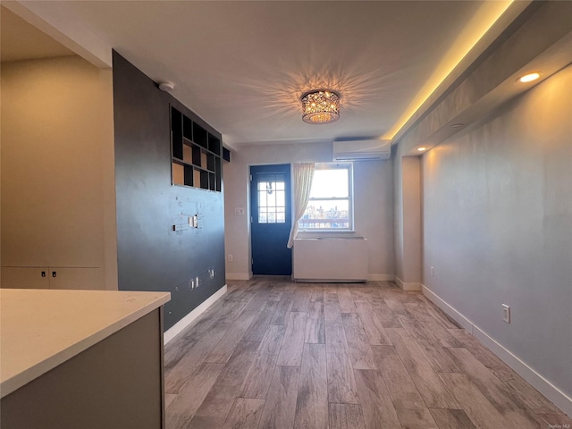 unfurnished room with light hardwood / wood-style flooring