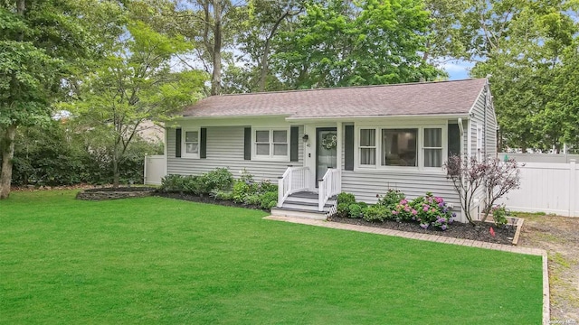 ranch-style home with a front lawn