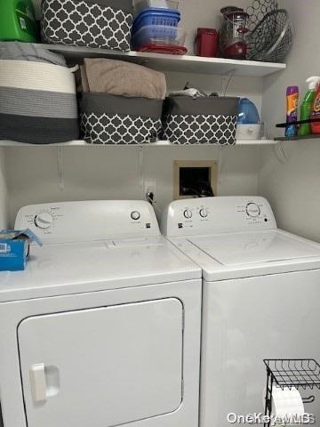 clothes washing area featuring washing machine and dryer