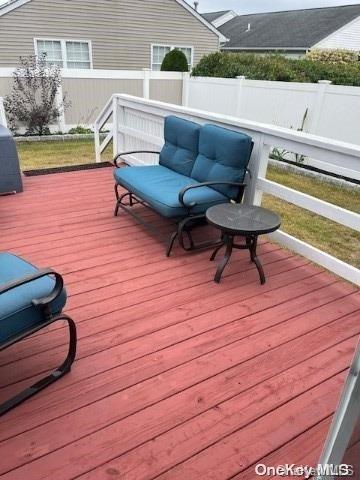 wooden terrace with outdoor lounge area